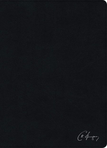  Agenda o libro de tapa dura negra texturizada con la firma de alguien en la parte inferior derecha.