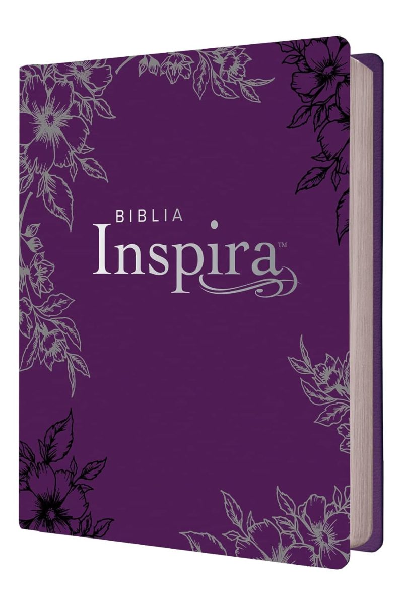 ** Portada de la Biblia Inspira con cubierta de color lila y decoraciones florales en las esquinas.