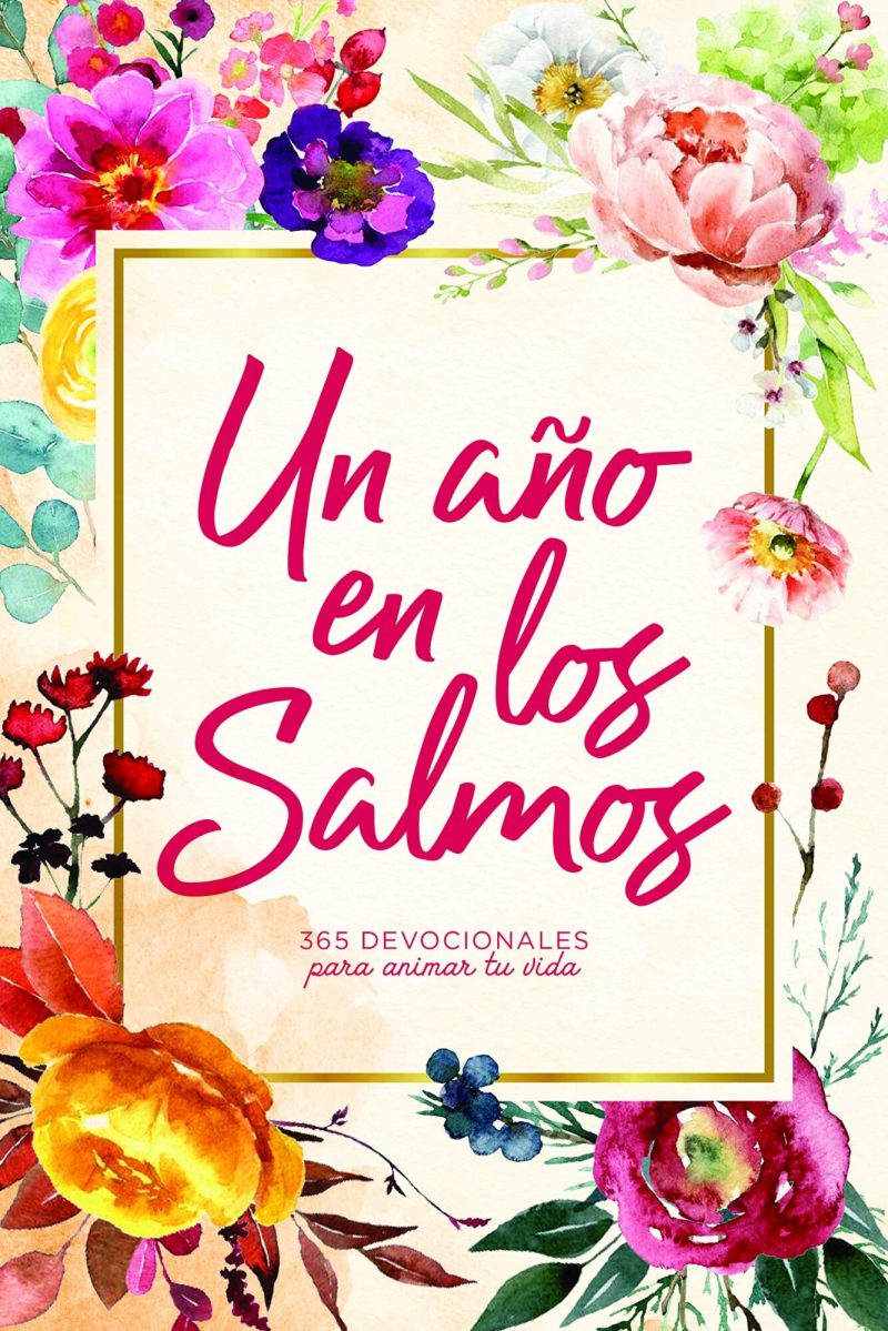 Portada de libro titulada Un año en los Salmos con un diseño colorido de flores acuareladas y texto en letras cursivas rojas, que indica que contiene 365 devocionales para animar la vida.