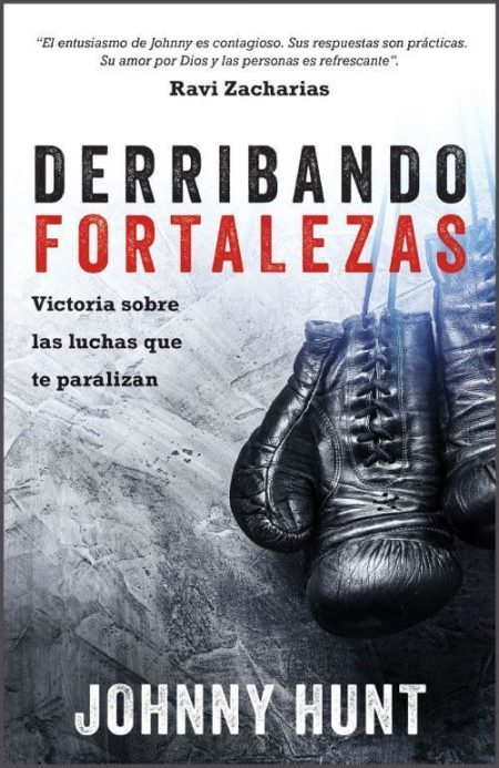 Derribando Fortalezas" de Johnny Hunt con unos guantes de boxeo colgados.