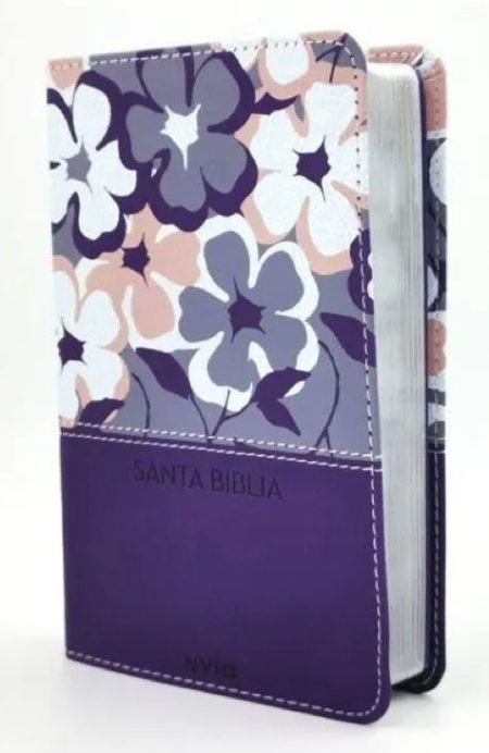 ** Biblia con cubierta floral en tonos morados y blancos.