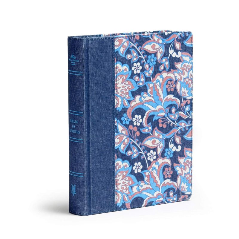 ** Libro de tapa dura con diseño floral en tonos azules y morados, combinado con lomo de tela azul.