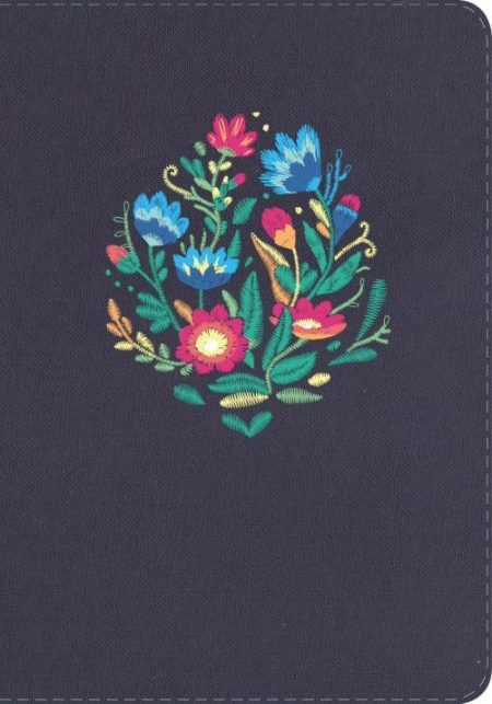 ** Cuaderno de tapa negra con un colorido diseño bordado de flores.