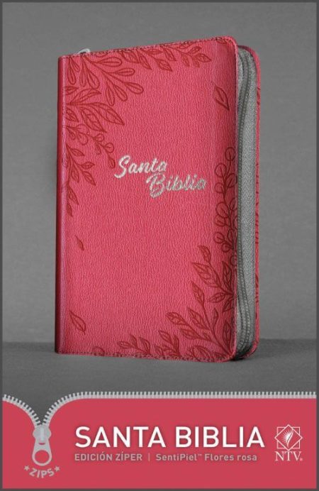 ** Biblia rosa con cierre y diseño floral en la portada.
