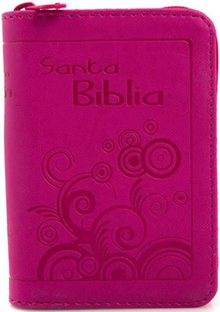 ** Biblia pequeña de color rosa con diseño floral grabado en la portada.