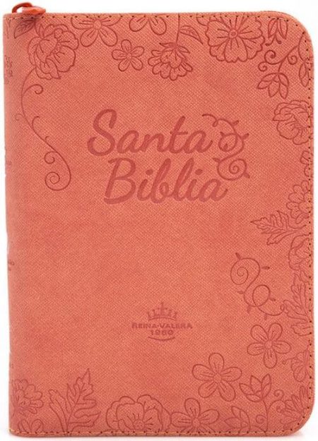 ** Biblia con funda floral en tono rosa.