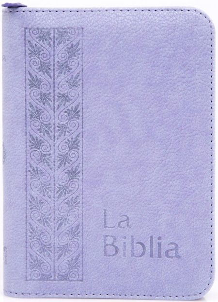 ** Imagen de una Biblia de tapa color lavanda, con un diseño floral decorativo en relieve en el lado izquierdo.