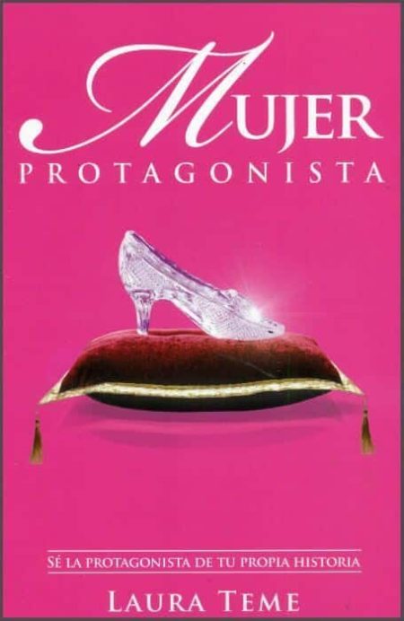 ** Portada rosa del libro "Mujer Protagonista" con un zapato de cristal sobre un cojín rojo, escrito por Laura Teme.